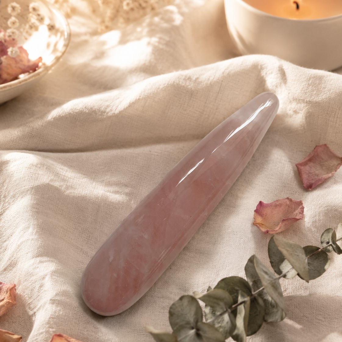 Pink rose quartz crystal wand for yoni exploration. 