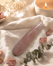 Pink rose quartz crystal wand for yoni exploration. 